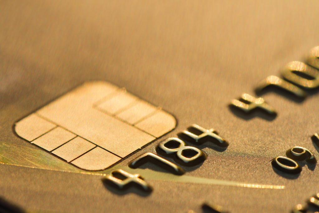 Close up of a credit card, picturing the chip and first 6 numbers of the card